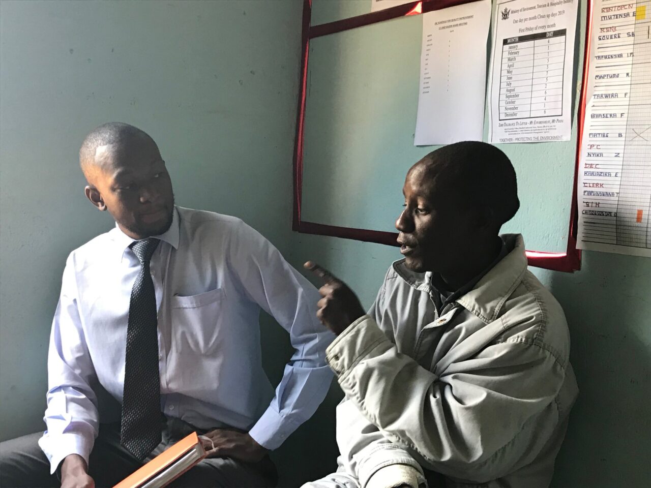 Tendai researcher Thabani interviewing Tenashe, community link facilitator at a clinic